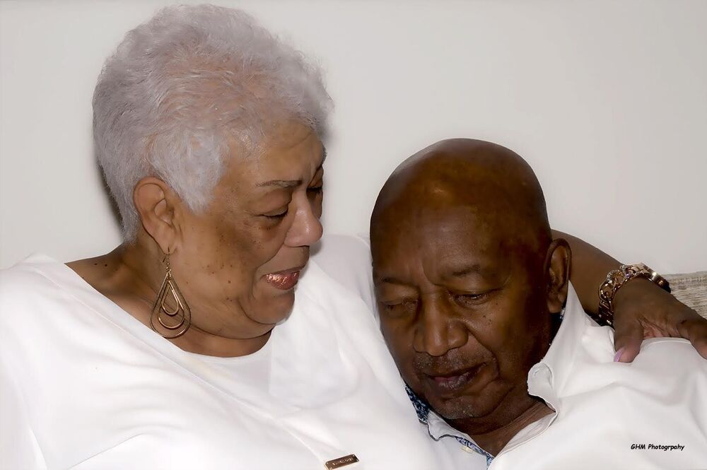 An older couple sharing a tender embrace