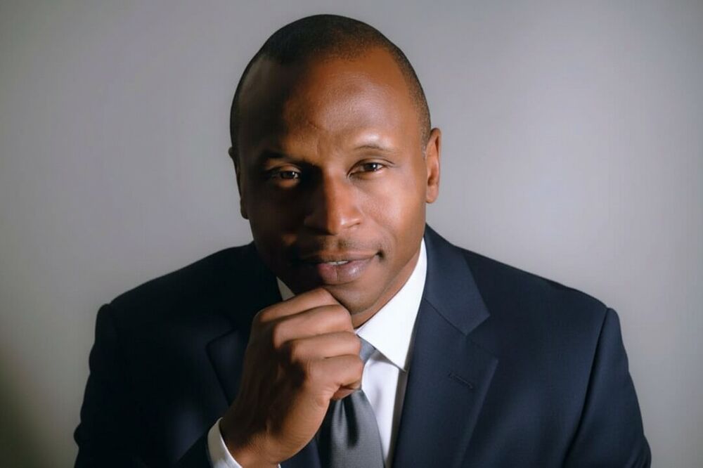 Studio professional portrait of a man in a dark suit