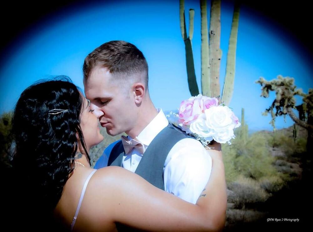 A newly married couple sharing a kiss