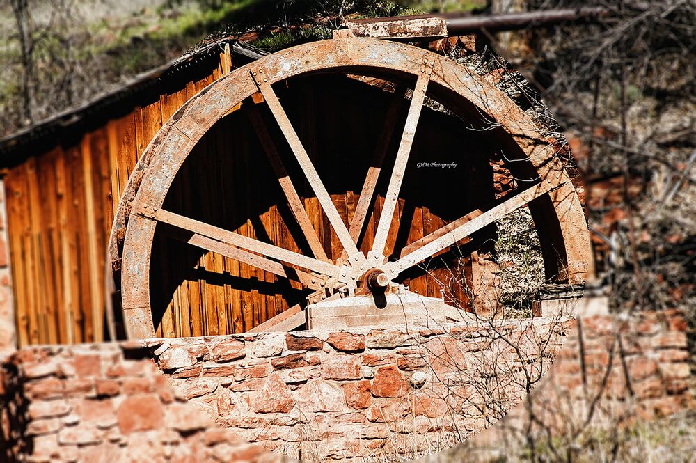 A rustic wooden waterwheel in the Sedona landscape